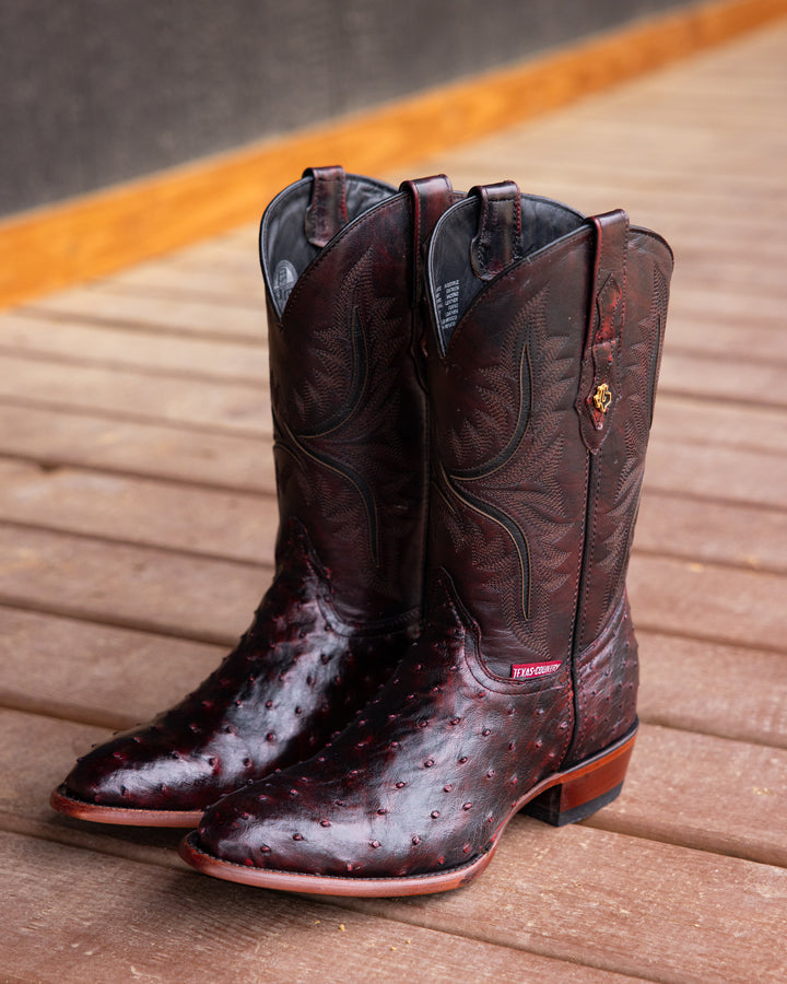 Men’s ostrich boots, full quill leather, exotic skin footwear, western-style boots, genuine hide craftsmanship, handmade cowboy boots, premium leather design, smooth finish ostrich, rustic men’s footwear, luxury Western fashion, traditional bootmaking, custom leather boots, durable ranch boots, authentic exotic leather, and high-quality Western wear.