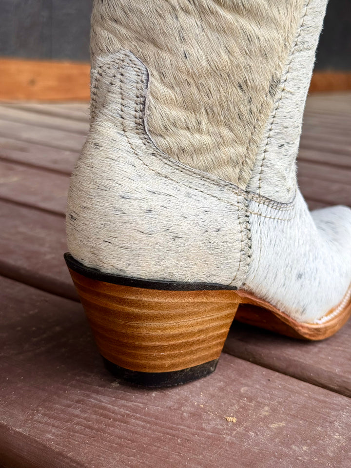 Western wear for women, cowgirl outfits, southern style clothing, fringe jacket, denim snap shirt, western dress, pearl snap shirt, high-waisted jeans, ranch wear, boho cowgirl style, leather cowboy boots, embroidered boots, square toe boots, ankle cowboy boots, cowgirl hat, western belt, fringe purse, turquoise jewelry, bandana, concho belt, boot accessories, cow print fashion, rodeo handbag, rustic necklace, Nashville fashion, rodeo ready, country girl style, Cowhide, Cow boots, Leather boots