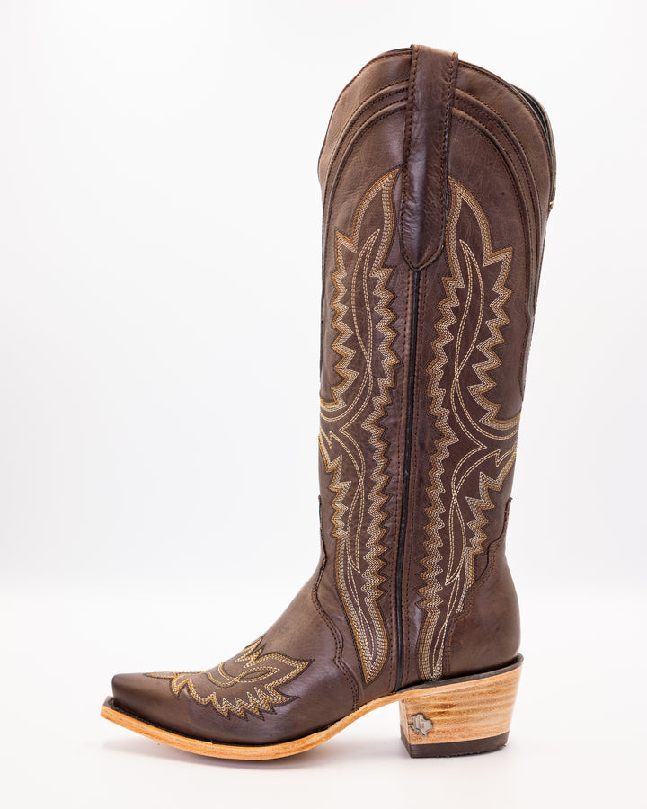 Western wear for women, cowgirl outfits, southern style clothing, fringe jacket, denim snap shirt, western dress, pearl snap shirt, high-waisted jeans, ranch wear, boho cowgirl style, leather cowboy boots, embroidered boots, square toe boots, ankle cowboy boots, cowgirl hat, western belt, fringe purse, turquoise jewelry, bandana, concho belt, boot accessories, cow print fashion, rodeo handbag, rustic necklace, Nashville fashion, rodeo ready, country girl style, 