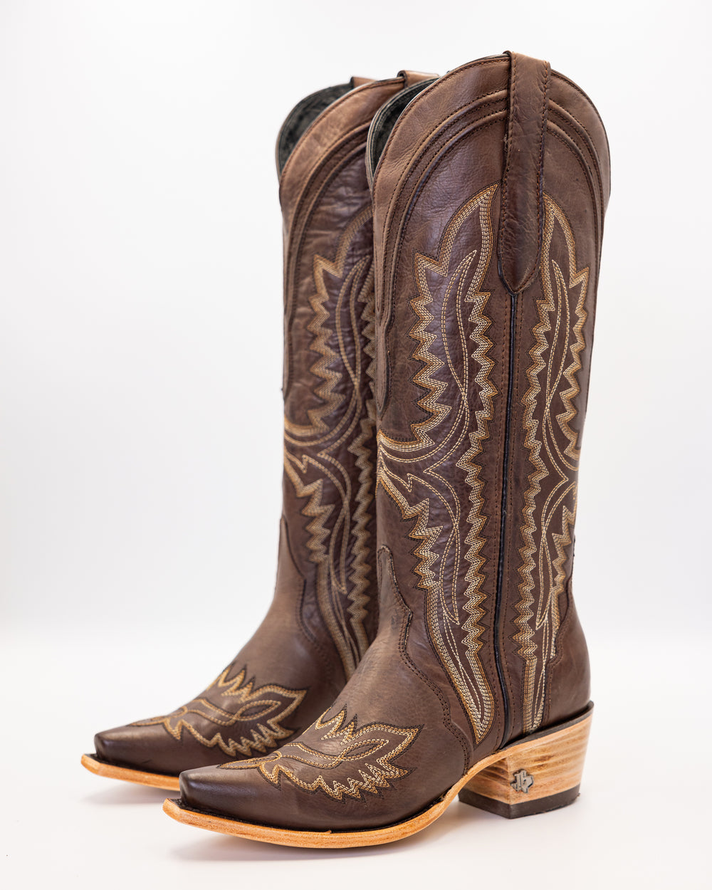 Western wear for women, cowgirl outfits, southern style clothing, fringe jacket, denim snap shirt, western dress, pearl snap shirt, high-waisted jeans, ranch wear, boho cowgirl style, leather cowboy boots, embroidered boots, square toe boots, ankle cowboy boots, cowgirl hat, western belt, fringe purse, turquoise jewelry, bandana, concho belt, boot accessories, cow print fashion, rodeo handbag, rustic necklace, Nashville fashion, rodeo ready, country girl style, 