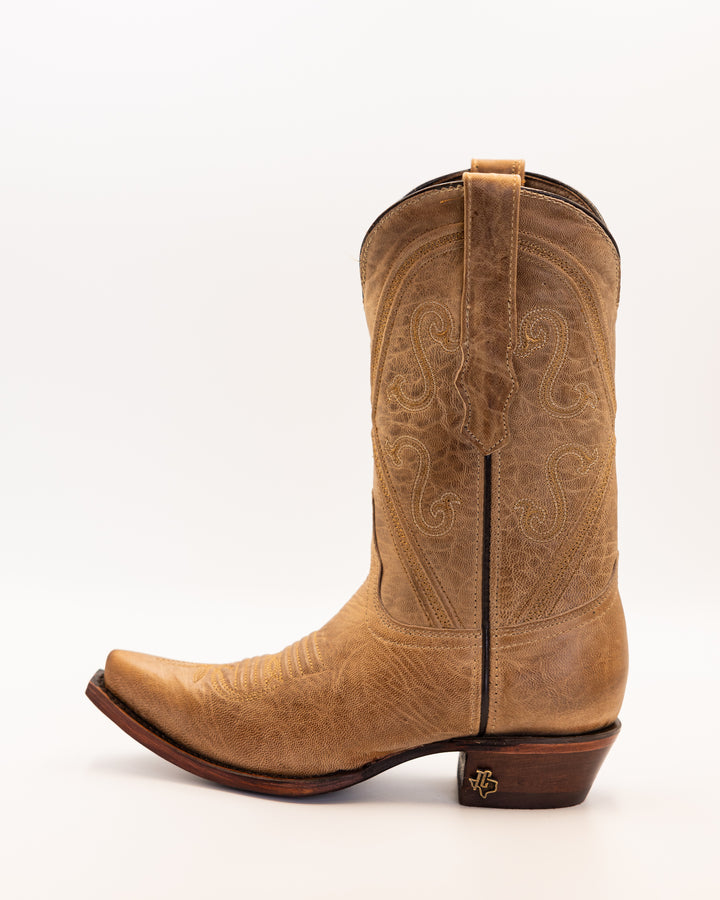 Western wear for women, cowgirl outfits, southern style clothing, fringe jacket, denim snap shirt, western dress, pearl snap shirt, high-waisted jeans, ranch wear, boho cowgirl style, leather cowboy boots, embroidered boots, square toe boots, ankle cowboy boots, cowgirl hat, western belt, fringe purse, turquoise jewelry, bandana, concho belt, boot accessories, cow print fashion, rodeo handbag, rustic necklace, Nashville fashion, rodeo ready, country girl style, Cowhide, Cow boots, Leather boots