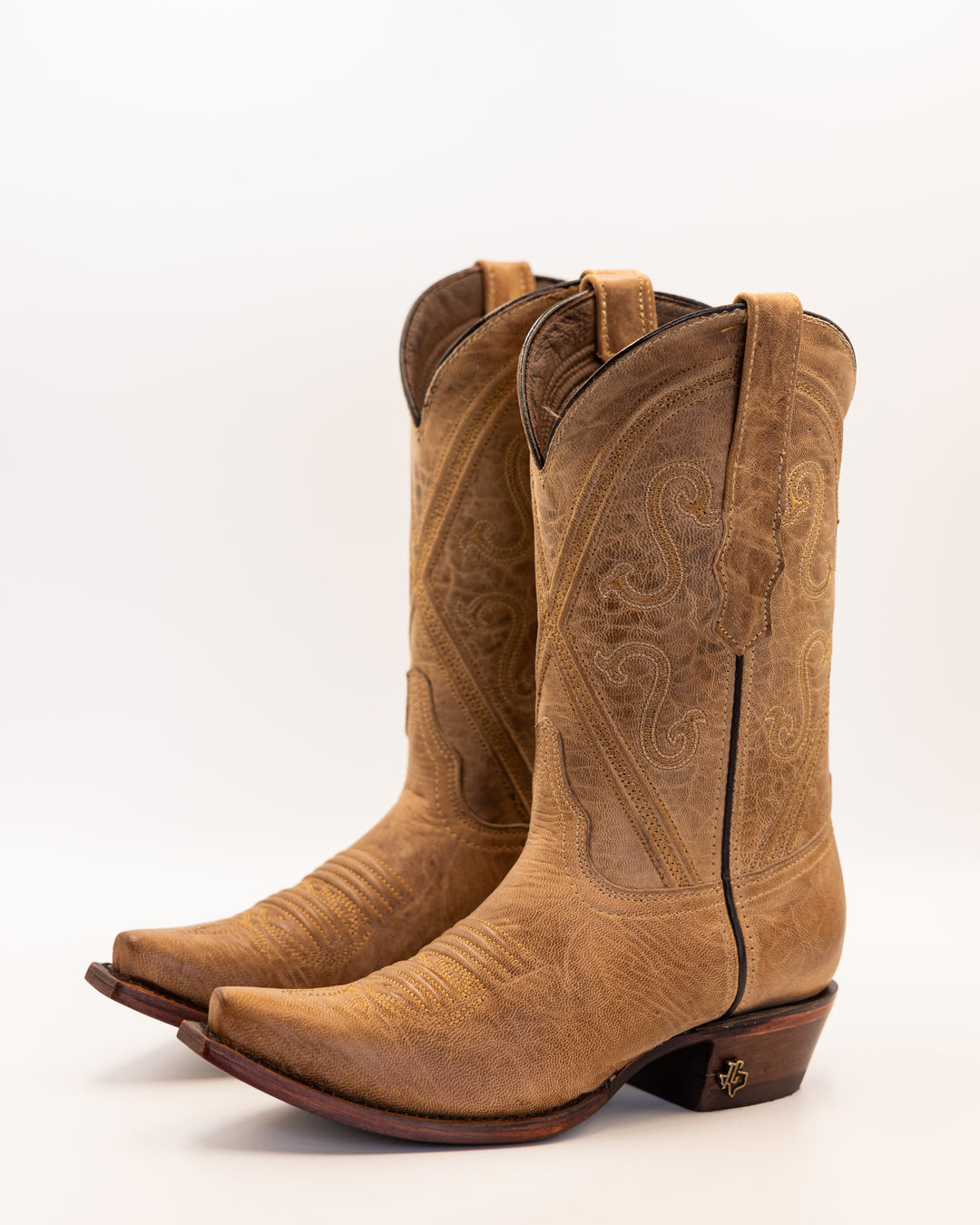 Western wear for women, cowgirl outfits, southern style clothing, fringe jacket, denim snap shirt, western dress, pearl snap shirt, high-waisted jeans, ranch wear, boho cowgirl style, leather cowboy boots, embroidered boots, square toe boots, ankle cowboy boots, cowgirl hat, western belt, fringe purse, turquoise jewelry, bandana, concho belt, boot accessories, cow print fashion, rodeo handbag, rustic necklace, Nashville fashion, rodeo ready, country girl style, Cowhide, Cow boots, Leather boots