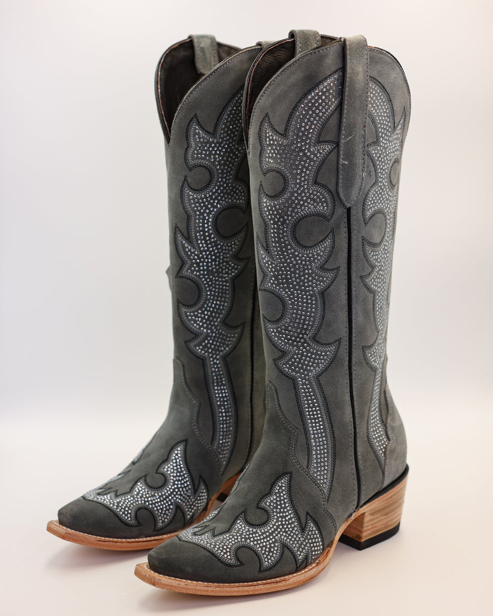 Western wear for women, cowgirl outfits, southern style clothing, fringe jacket, denim snap shirt, western dress, pearl snap shirt, high-waisted jeans, ranch wear, boho cowgirl style, leather cowboy boots, embroidered boots, square toe boots, ankle cowboy boots, cowgirl hat, western belt, fringe purse, turquoise jewelry, bandana, concho belt, boot accessories, cow print fashion, rodeo handbag, rustic necklace, Nashville fashion, rodeo ready, country girl style, 