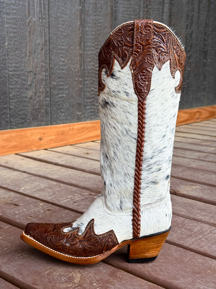 Western wear for women, cowgirl outfits, southern style clothing, fringe jacket, denim snap shirt, western dress, pearl snap shirt, high-waisted jeans, ranch wear, boho cowgirl style, leather cowboy boots, embroidered boots, square toe boots, ankle cowboy boots, cowgirl hat, western belt, fringe purse, turquoise jewelry, bandana, concho belt, boot accessories, cow print fashion, rodeo handbag, rustic necklace, Nashville fashion, rodeo ready, country girl style, Cowhide, Cow boots, Leather boots