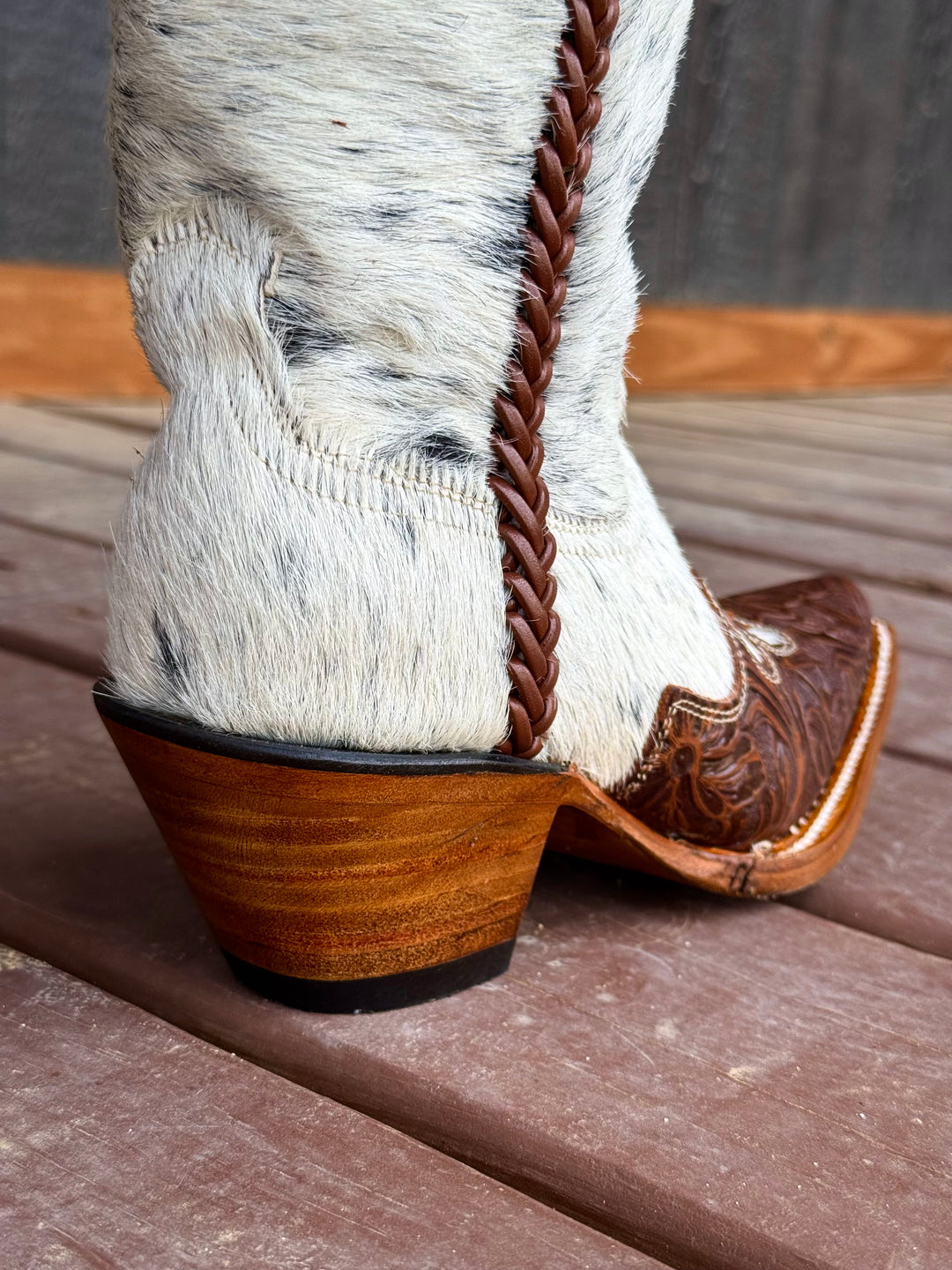 Western wear for women, cowgirl outfits, southern style clothing, fringe jacket, denim snap shirt, western dress, pearl snap shirt, high-waisted jeans, ranch wear, boho cowgirl style, leather cowboy boots, embroidered boots, square toe boots, ankle cowboy boots, cowgirl hat, western belt, fringe purse, turquoise jewelry, bandana, concho belt, boot accessories, cow print fashion, rodeo handbag, rustic necklace, Nashville fashion, rodeo ready, country girl style, Cowhide, Cow boots, Leather boots
